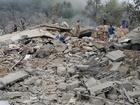 Lebanese emergency teams, soldiers and civilians conduct search and rescue operations after an Israeli air strike on the village of Aitou.