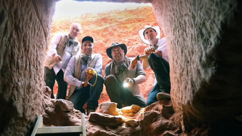 Dr Fares Braizat (from left), Fadi Balawi, Josh Gates and Dr Pearce Paul Creasman look into the newly discovered tomb at Petra. 