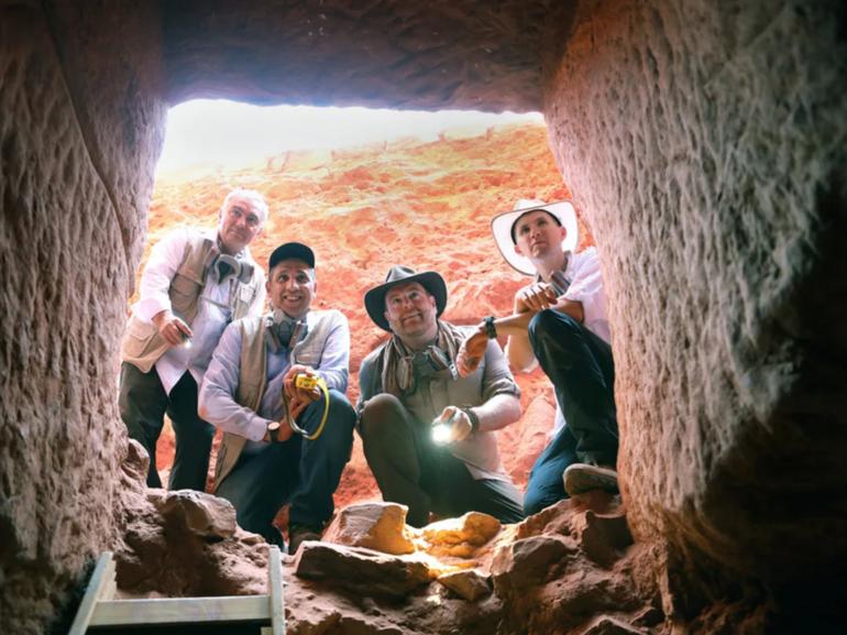 Dr Fares Braizat (from left), Fadi Balawi, Josh Gates and Dr Pearce Paul Creasman look into the newly discovered tomb at Petra. 