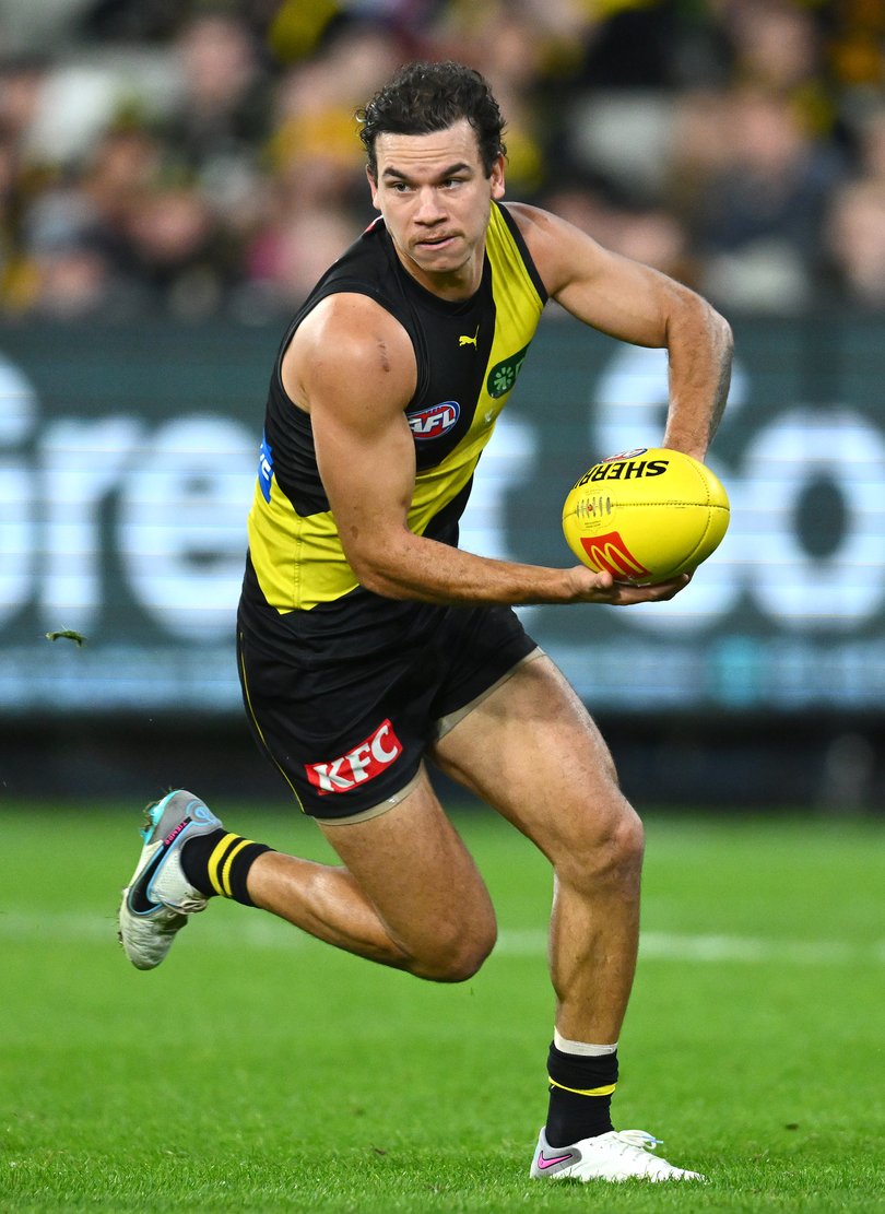 MELBOURNE, AUSTRALIA - MAY 12: Daniel Rioli of the Tigers handballs during the round nine AFL match between Richmond Tigers and Geelong Cats at Melbourne Cricket Ground, on May 12, 2023, in Melbourne, Australia. (Photo by Quinn Rooney/Getty Images via AFL Photos)