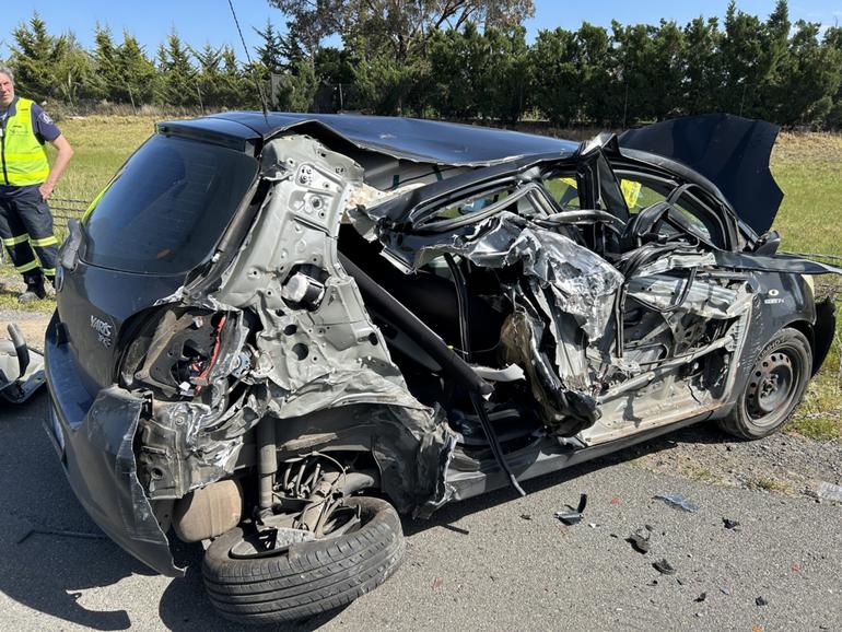 A heavy vehicle is believed to have crashed into a black Toyota Yaris parked in the emergency lane on the Calder Fwy at Keilor Lodge about 2.30pm Thursday.