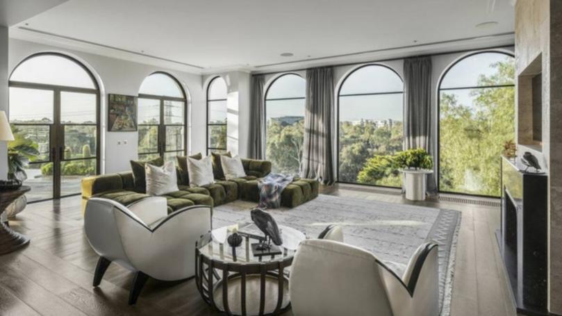 Arched windows showcase city views and allow for an abundance of natural light.