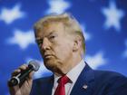 Former President Donald Trump, the Republican presidential nominee, speaks during a town hall with Gov. Kristi Noem of South Dakota at The Greater Philadelphia Expo Center & Fairgrounds in Oaks, Pa., Oct. 14, 2024. During his closing remarks at the event, Trump called his opponents “evil.” (Michelle Gustafson/The New York Times)