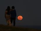 A Supermoon rises above Bald Hill at Stanwell Park South of Sydney, Wednesday, September 18, 2024. (AAP Image/Dean Lewins) NO ARCHIVING