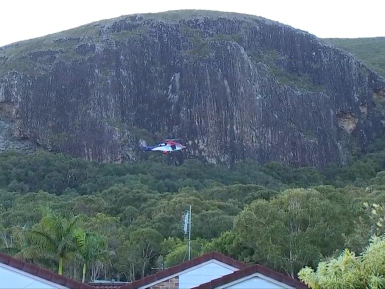 A young child is in hospital with significant injuries after he was found at the base of a cliff at a Queensland national park.