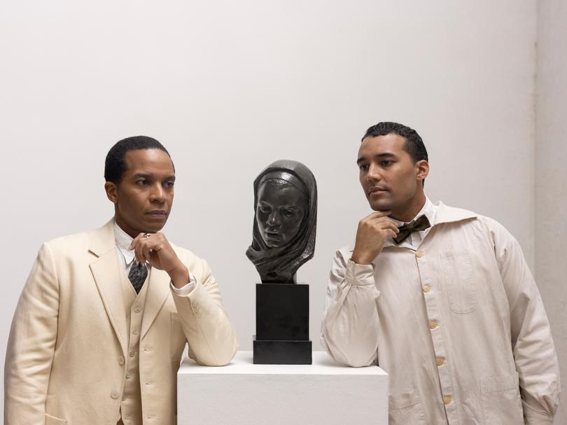 Alain Locke and Dr Albert C Barnes view one of the pieces for the video.