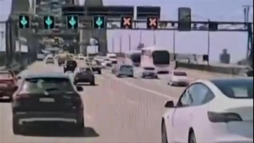 Dashcam has recorded the moment a driver veered onto the wrong side of the road on the Sydney Harbour Bridge.