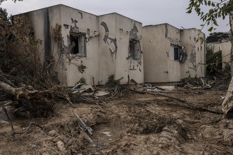 A row of homes shows destroyed windows of the safe rooms where people sheltered during the Oct. 7, 2023, Hamas attack in Kibbutz Azza near the border of Gaza.