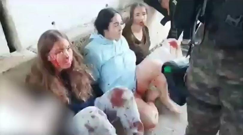 Terrified teenage girls taken hostage in the October 7 terrorist attack planned by Sinwar. 