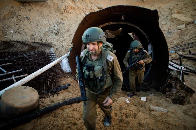 Israeli soldiers exit a tunnel near the border with Israel in northern Gaza Strip. 