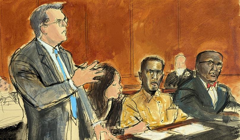 In this courtroom sketch, Sean "Diddy" Combs' defense attorney Marc Agnifilo, left, addresses the judge while Combs, seated second from right, in prison uniform, watches during a hearing in federal court in New York, Thursday, Oct. 10, 2024. Combs' new defense attorney, Anthony Ricco is seated far right. (Elizabeth Williams via AP)