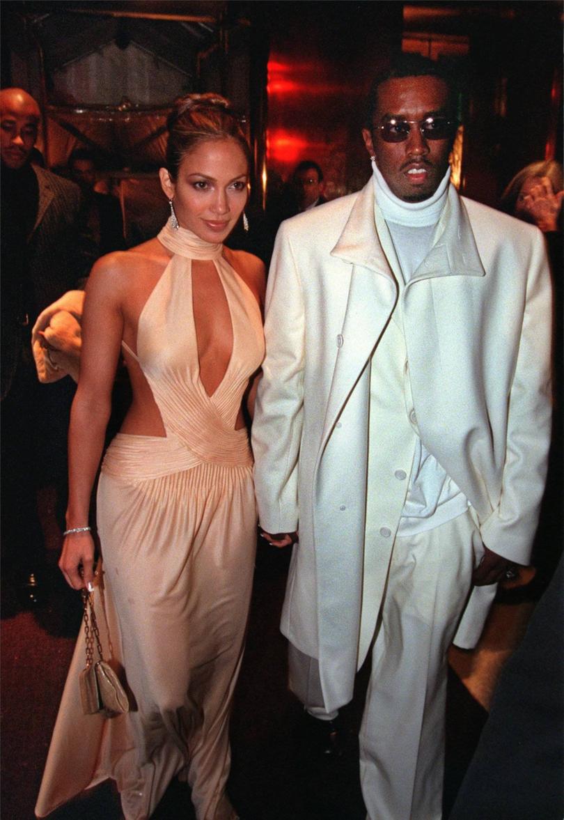 Entertainer Jennifer Lopez is escorted to the Metropolitan Museum of Art's annual Costume Insititute theme party by Sean "Puffy" Combs in New York, Monday, Dec. 6, 1999. This year's theme is "Rock Style," that spotlights classic rock-'n'-roll performers and their pervasive influence on style. (AP Photo/Metroploitan Museum Of Art, Don Pollard)