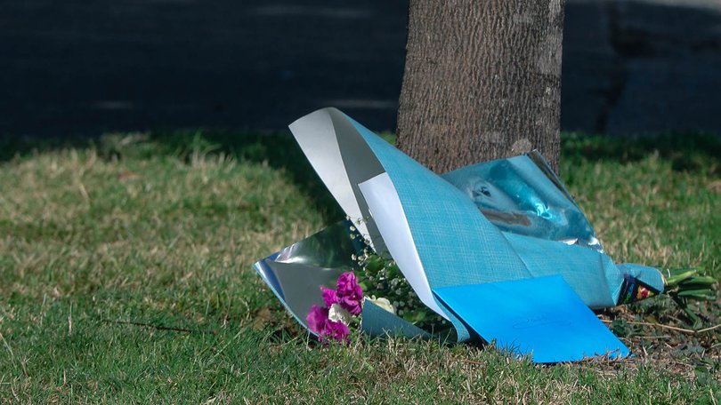 Floral tributes left at the scene where David Connolly died after he was stabbed in the chest in Brisbane in January 2023.