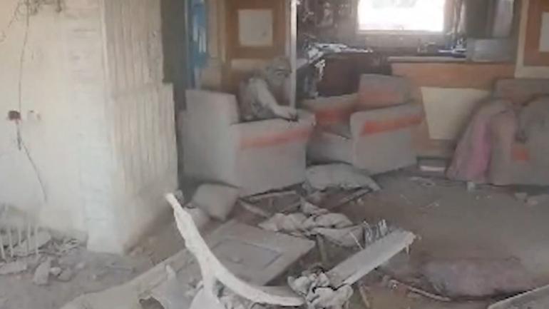 Drone footage shows Yahya Sinwar covered in dust, throwing debris in his final moments.