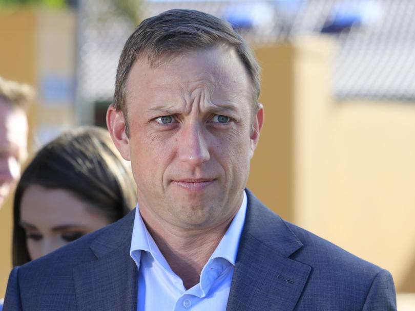 Queensland Health Minister Stephen Miles speaks to the media during a press conference outside the Earle Haven Nursing Home following its closure on the Gold Coast, Friday, July 12, 2019. Residents from the retirement home are being removed from the facility which has reportedly gone into administration. (AAP Image/Tim Marsden) NO ARCHIVING