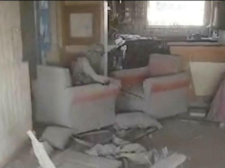 The Israeli army says a drone recorded a video of Yahya Sinwar in a chair in a destroyed building. (AP PHOTO)