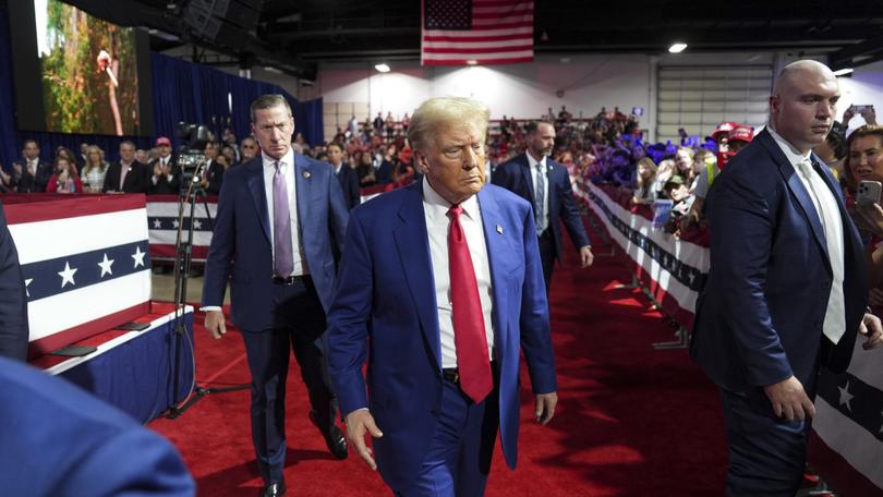 Former president Donald Trump walks to greet supporters during a town hall in Oaks, Pa., on Oct. 14. 