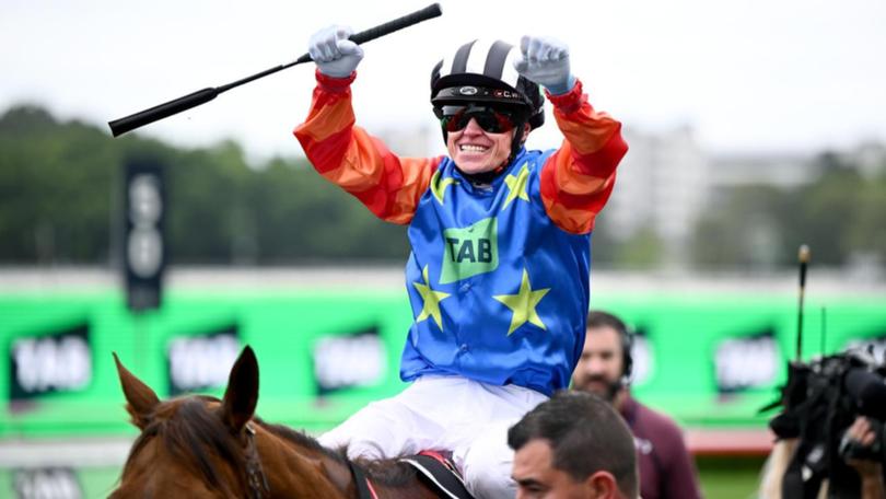 Jockey Craig Williams celebrates his great ride on Bella Nipotina in The Everest. (Bianca De Marchi/AAP PHOTOS)