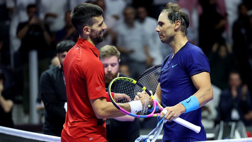 Novak Djokovic and Rafael Nadal shake hands on court one last time.