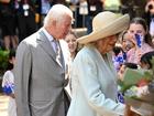 King Charles III and Queen Camilla greet people as they arrive at St Thomas' Anglican Church.