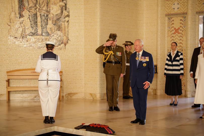 King Charles III and Queen Camilla stand after laying a wreath at the Australian War Memorial in Canberra.