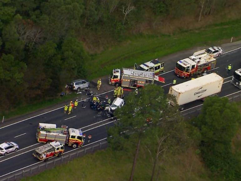 Two people are dead and another fighting for life after a crash near Moreton Bay on Sunday afternoon.