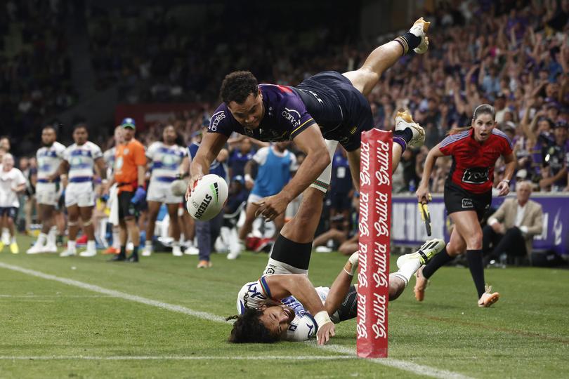 MELBOURNE, AUSTRALIA - MARCH 16: Xavier Coates of the Storm scores the match winning try during the round two NRL match between Melbourne Storm and New Zealand Warriors at AAMI Park, on March 16, 2024, in Melbourne, Australia. (Photo by Daniel Pockett/Getty Images)