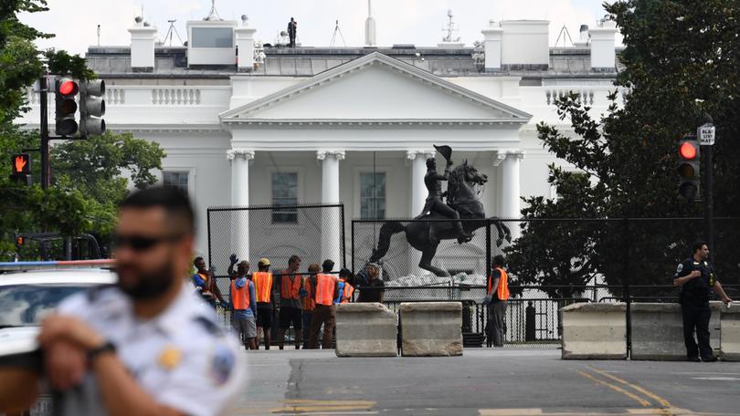 Fencing is put up along H Street NW to block access to Lafayette Square in Washington in June 2020. 