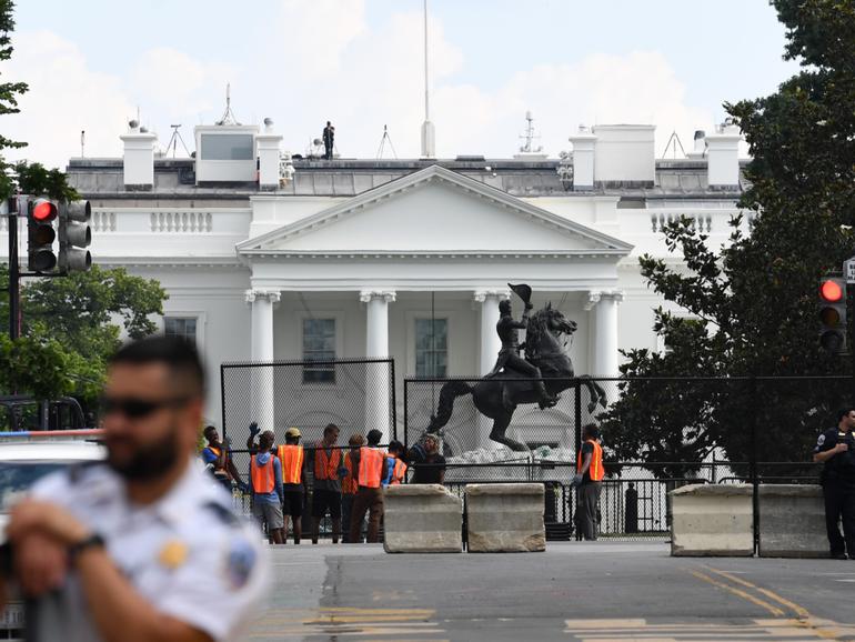 Fencing is put up along H Street NW to block access to Lafayette Square in Washington in June 2020. 