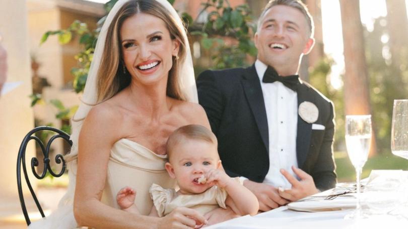 Lucy, Robbie and Sam were all smiles on their big day.