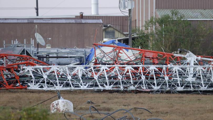 A view from the north side of the collapsed radio tower where a helicopter collided with the structure, killing all aboard.