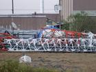 A view from the north side of the collapsed radio tower where a helicopter collided with the structure, killing all aboard.