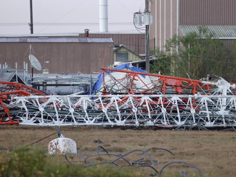 A view from the north side of the collapsed radio tower where a helicopter collided with the structure, killing all aboard.