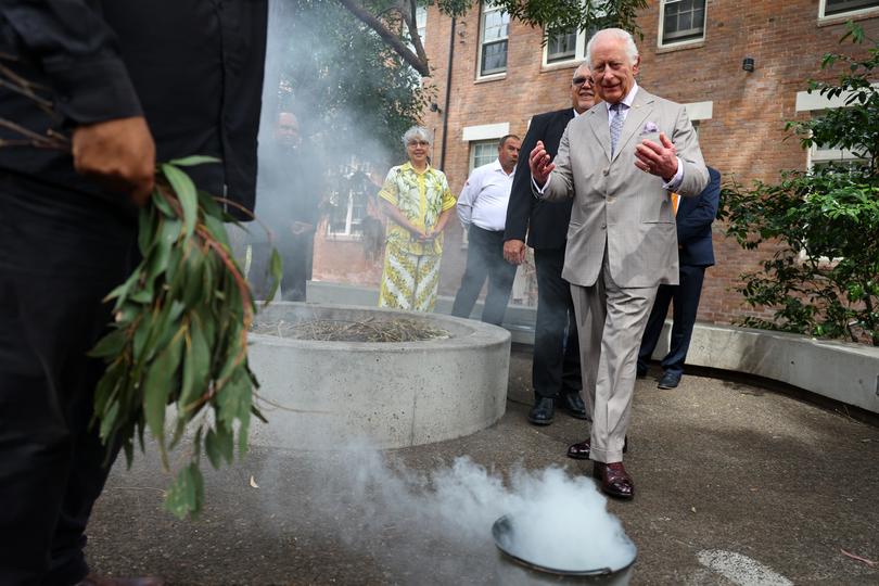 SYDNEY, AUSTRALIA - OCTOBER 22: King Charles III takes part in a smoking ceremony during a visit to the National Centre for Indigenous Excellence on October 22, 2024 in Sydney, Australia. The King's visit to Australia is his first as monarch, and the Commonwealth Heads of Government Meeting (CHOGM) in Samoa will be his first as head of the Commonwealth. (Photo by Toby Melville-Pool/Getty Images)