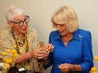 Ronni Kahn, OzHarvest founder, presents a teaspoon to Queen Camilla during the queen's visit to Refettorio OzHarvest Sydney on October 22.