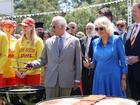 King Charles and Queen Camilla cook sausages for the food stalls at the Premier’s Community Barbeque at Parramatta Park.