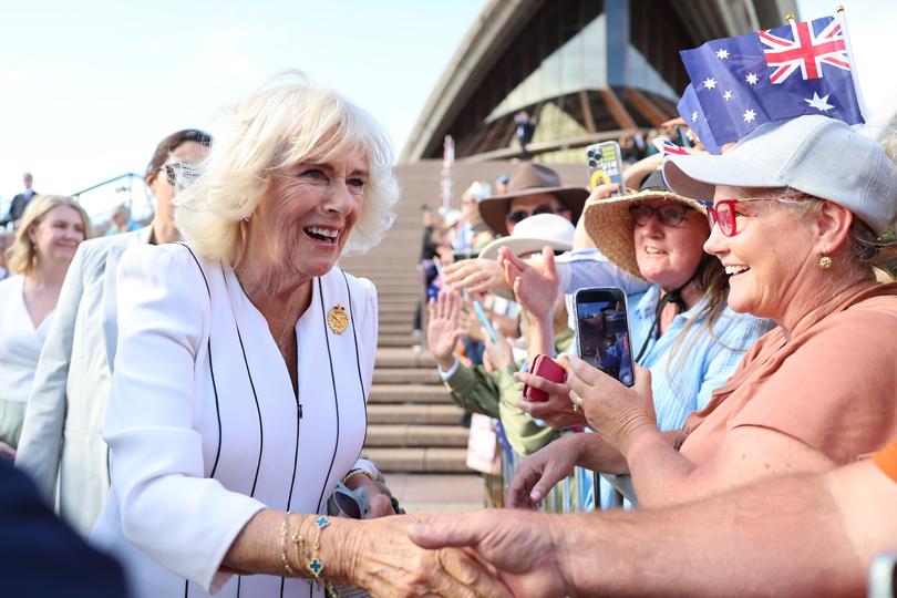 SYDNEY, AUSTRALIA - OCTOBER 22: Queen Camilla greets spectators during a visit to the Sydney Opera House on October 22, 2024 in Sydney, Australia. The King's visit to Australia is his first as monarch, and the Commonwealth Heads of Government Meeting (CHOGM) in Samoa will be his first as head of the Commonwealth. (Photo by Chris Jackson/Getty Images)