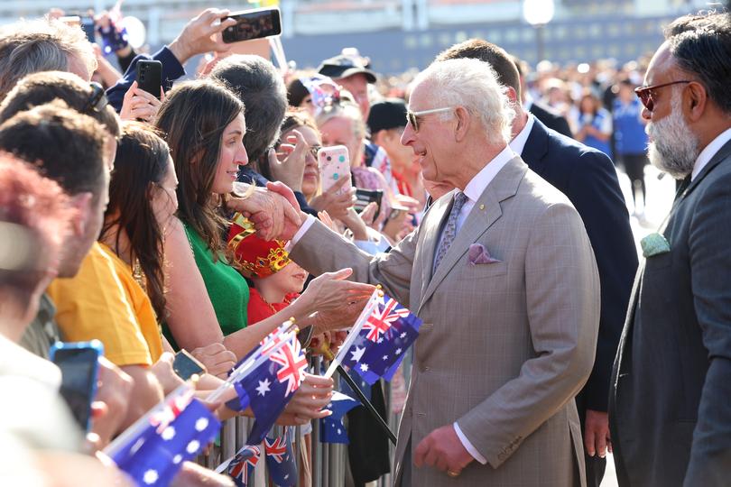 SYDNEY, AUSTRALIA - OCTOBER 22: King Charles III greets spectators during a visit to the Sydney Opera House on October 22, 2024 in Sydney, Australia. The King's visit to Australia is his first as monarch, and the Commonwealth Heads of Government Meeting (CHOGM) in Samoa will be his first as head of the Commonwealth. (Photo by Chris Jackson/Getty Images)