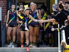 Kate Dempsey and daughter Pippa lead out the Tigers for the Pride round match against Geelong.