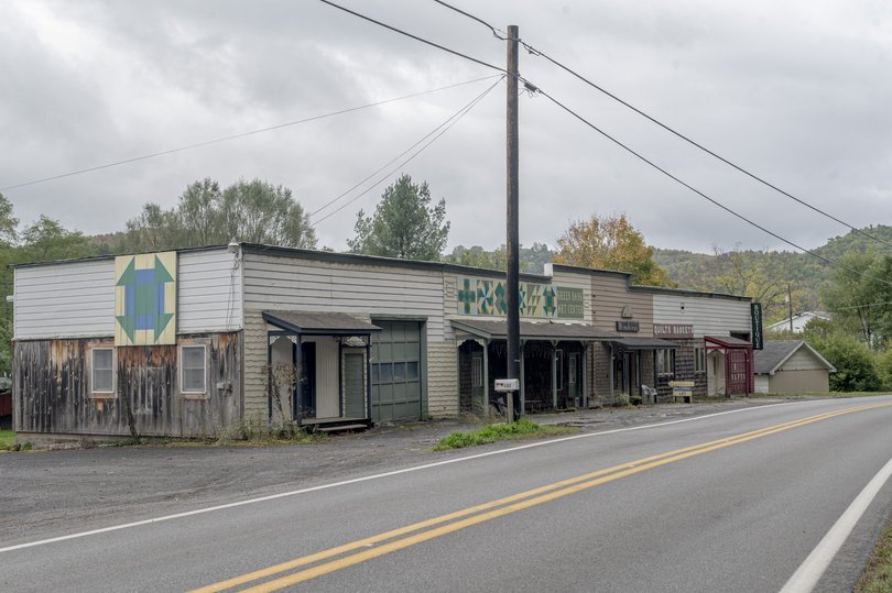 A quiet stretch of buildings along Green Bank's main thoroughfare, a two-lane highway.