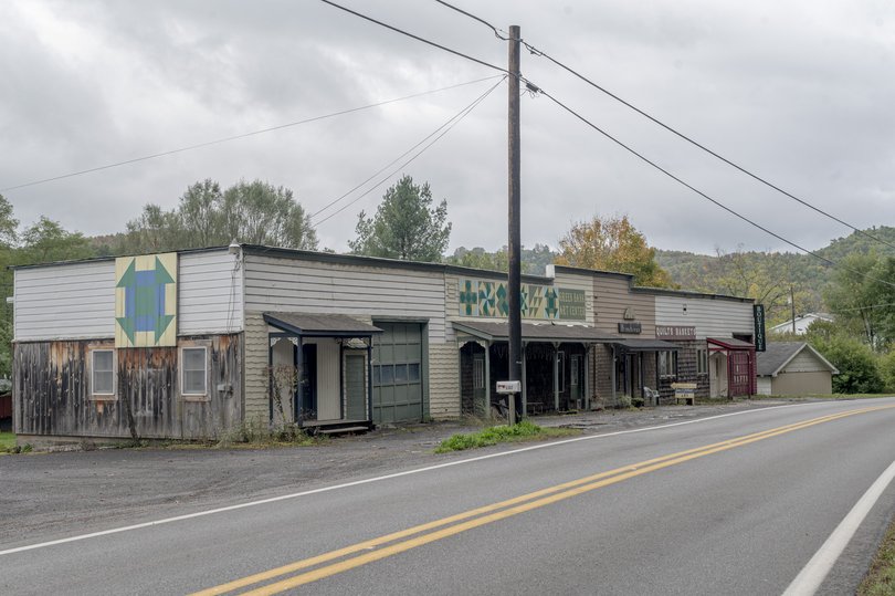 A quiet stretch of buildings along Green Bank's main thoroughfare, a two-lane highway. 