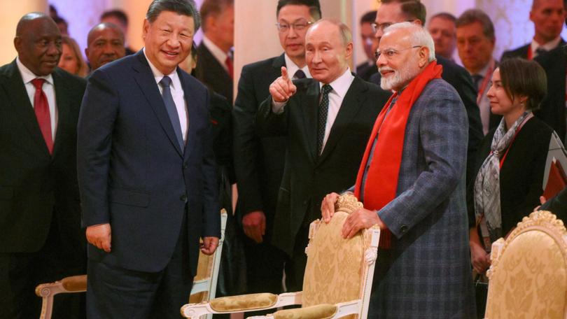 China’s Xi Jinping, Russia’s Vladimir Putin and Indian Prime Minister Narendra Modi meet on the sidelines of the BRICS Summit in Kazan, Russia.