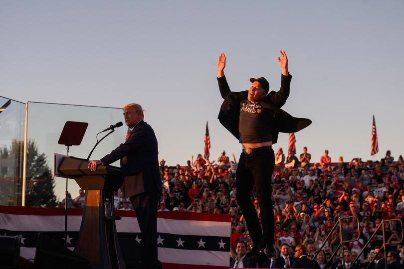 Elon Musk, chief executive officer of Tesla Inc., joins former US President Donald Trump during a campaign event at the Butler Farm Show in Butler, Pennsylvania, US, on Saturday, Oct. 5, 2024. Elon Musk will campaign with the former president on Saturday, joining a rally at the scene of a summer assassination attempt and cementing his role as one of the Republican candidate's key backers. Photographer: Justin Merriman/Bloomberg