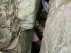 A young bushwalker spent seven hours wedged upside-down between boulders in the NSW Hunter Valley.