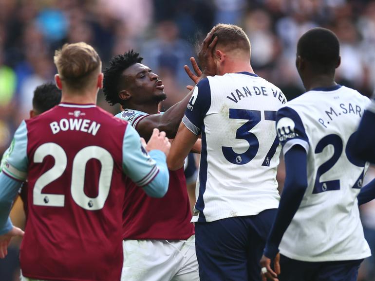 Mohammed Kudus of West Ham United clashes with Micky van de Ven of Tottenham Hotspur.