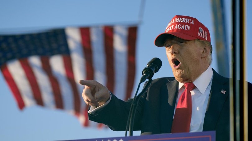 A man was found with guns and ammunition at a security checkpoint near Donald Trump's rally.  (AP PHOTO)