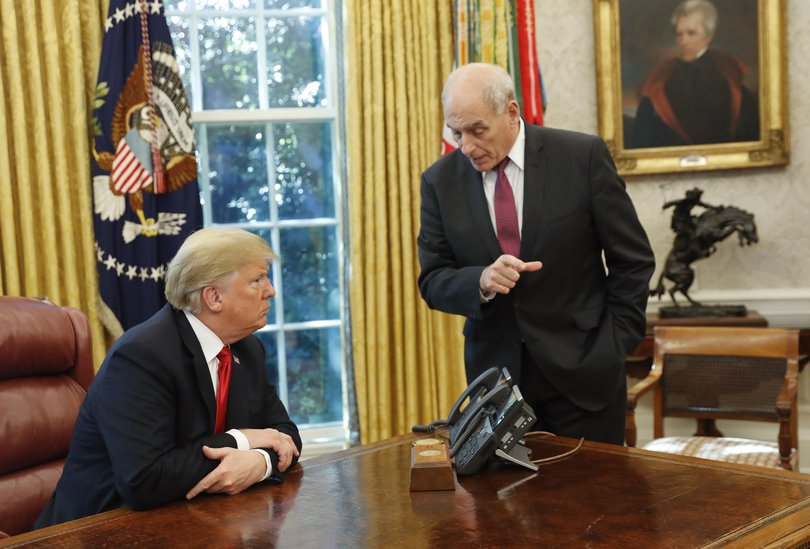 Former President Donald Trump listens to then White House Chief of Staff John Kelly, right, in the Oval Office.