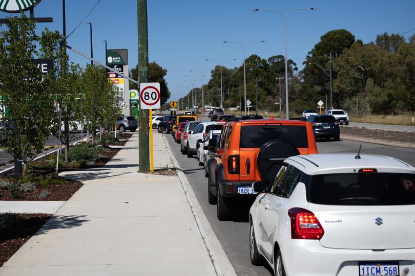 Cars line up for the drive-thru at WA’s first Starbucks.