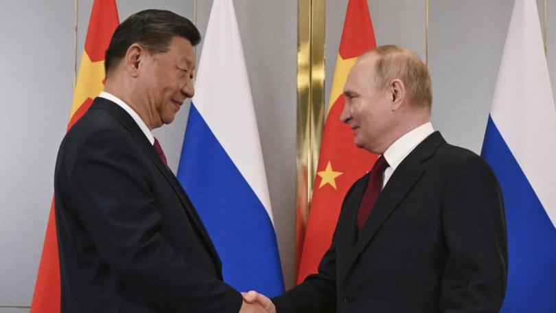 A Chinese foreign ministry spokesperson has unleashed on Australia as President Xi Jinping and President Vladamir Putin meet in Russia.  (AP PHOTO)