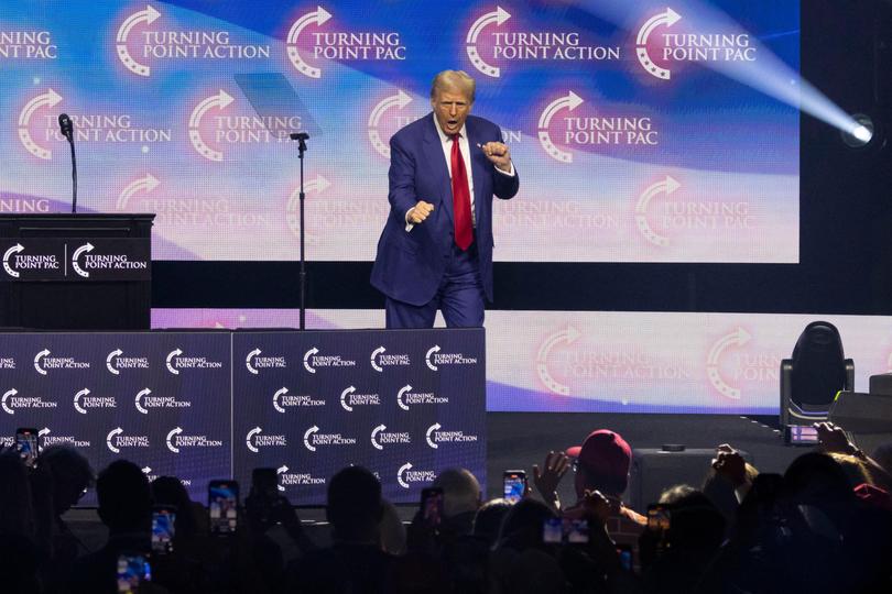 Former US President and Republican presidential candidate Donald Trump dances onstage during a campaign rally at the Gas South Arena in Duluth, Georgia, on October 23, 2024. (Photo by CHRISTIAN MONTERROSA / AFP) CHRISTIAN MONTERROSA